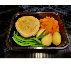 Home made individual steak pie, root mash, potatoes, green beans and gravy